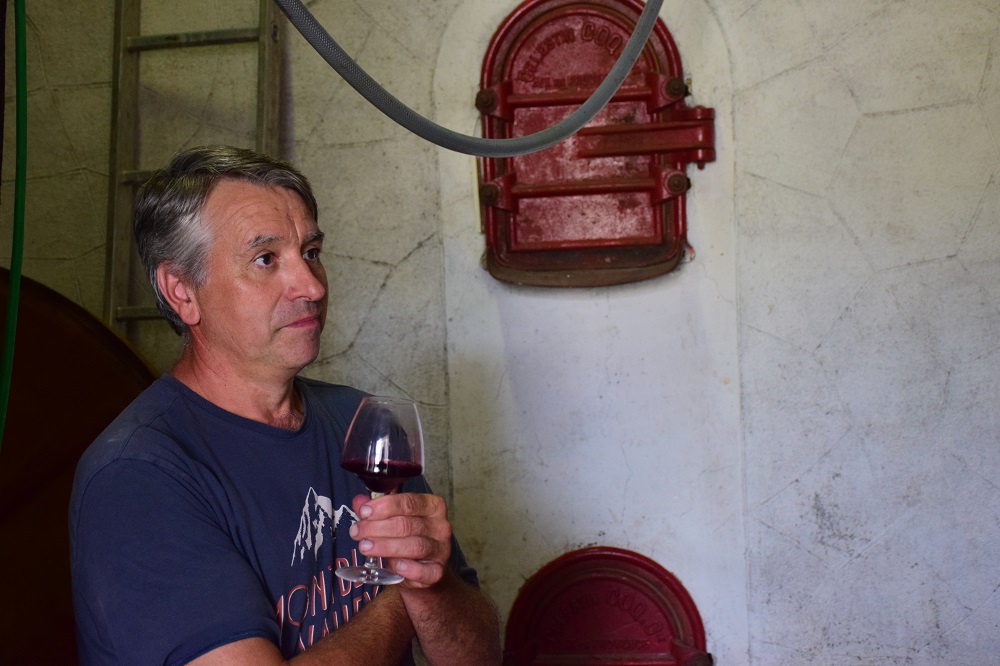 Domaine Combe Queyzaire's Denis with a glass