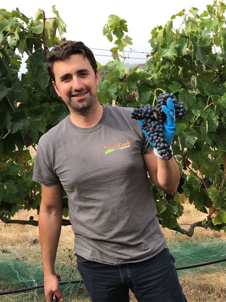 Model Farm: Sean with a grape bunch